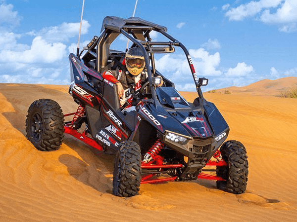 The Polaris RZR XP 1000 (1-Seater) is a high-performance dune buggy (UTV) built for aggressive off-roading. With its powerful 999cc engine, long-travel suspension, and race-ready design, it’s ideal for extreme desert adventures in Dubai. This vehicle offers full control, fast acceleration, and a thrilling ride over red sand dunes — perfect for solo riders who want an adrenaline-filled private experience.