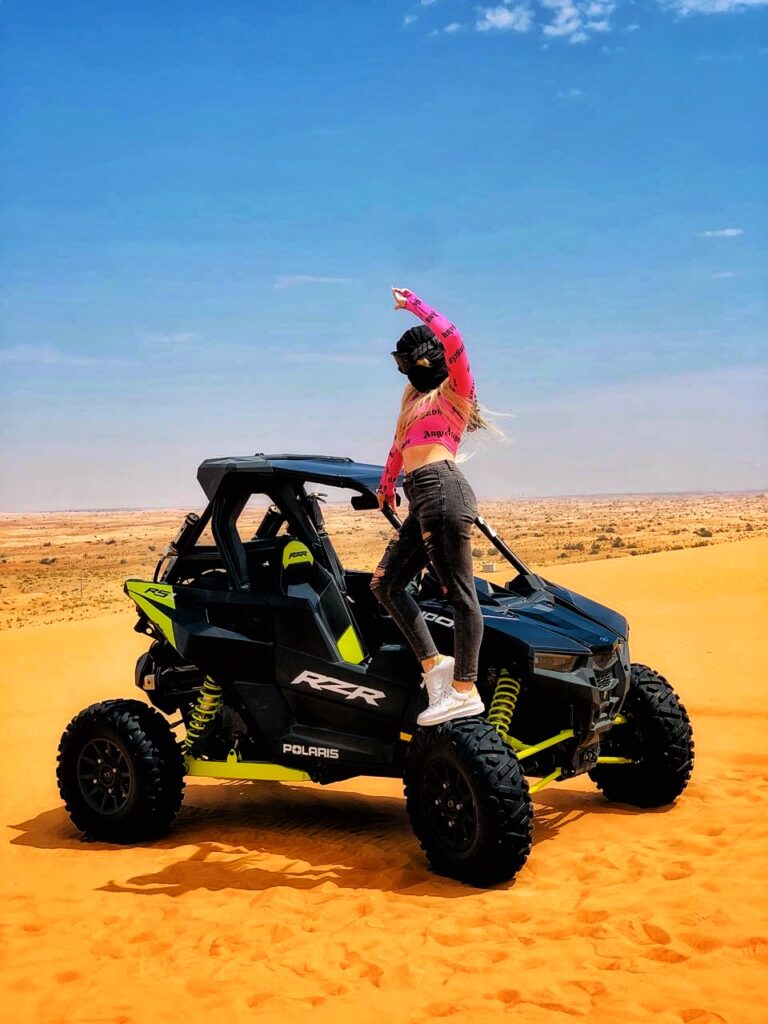The Polaris RZR XP 1000 (1-Seater) is a high-performance dune buggy (UTV) built for aggressive off-roading. With its powerful 999cc engine, long-travel suspension, and race-ready design, it’s ideal for extreme desert adventures in Dubai. This vehicle offers full control, fast acceleration, and a thrilling ride over red sand dunes — perfect for solo riders who want an adrenaline-filled private experience.