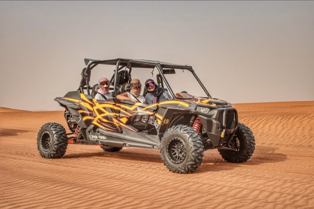 Explore Dubai’s stunning red dunes in one powerful machine built for adventure! The 4-Seater Polaris RZR 1000cc buggy offers high performance, comfort, and safety — ideal for families, friends, or small groups who want to share the fun without splitting into separate rides.