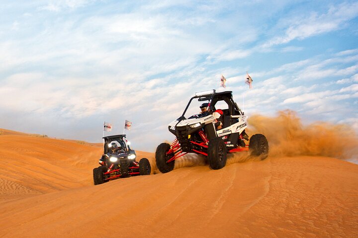 The Polaris RZR XP 1000 (1-Seater) is a high-performance dune buggy (UTV) built for aggressive off-roading. With its powerful 999cc engine, long-travel suspension, and race-ready design, it’s ideal for extreme desert adventures in Dubai. This vehicle offers full control, fast acceleration, and a thrilling ride over red sand dunes — perfect for solo riders who want an adrenaline-filled private experience.