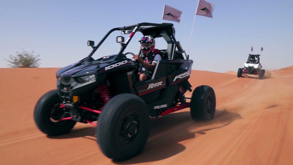 The Polaris RZR XP 1000 (1-Seater) is a high-performance dune buggy (UTV) built for aggressive off-roading. With its powerful 999cc engine, long-travel suspension, and race-ready design, it’s ideal for extreme desert adventures in Dubai. This vehicle offers full control, fast acceleration, and a thrilling ride over red sand dunes — perfect for solo riders who want an adrenaline-filled private experience.
